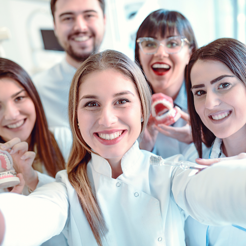 A dental team very happy they promoted their dental services through dental SEO services as it's brought in many prospective patients