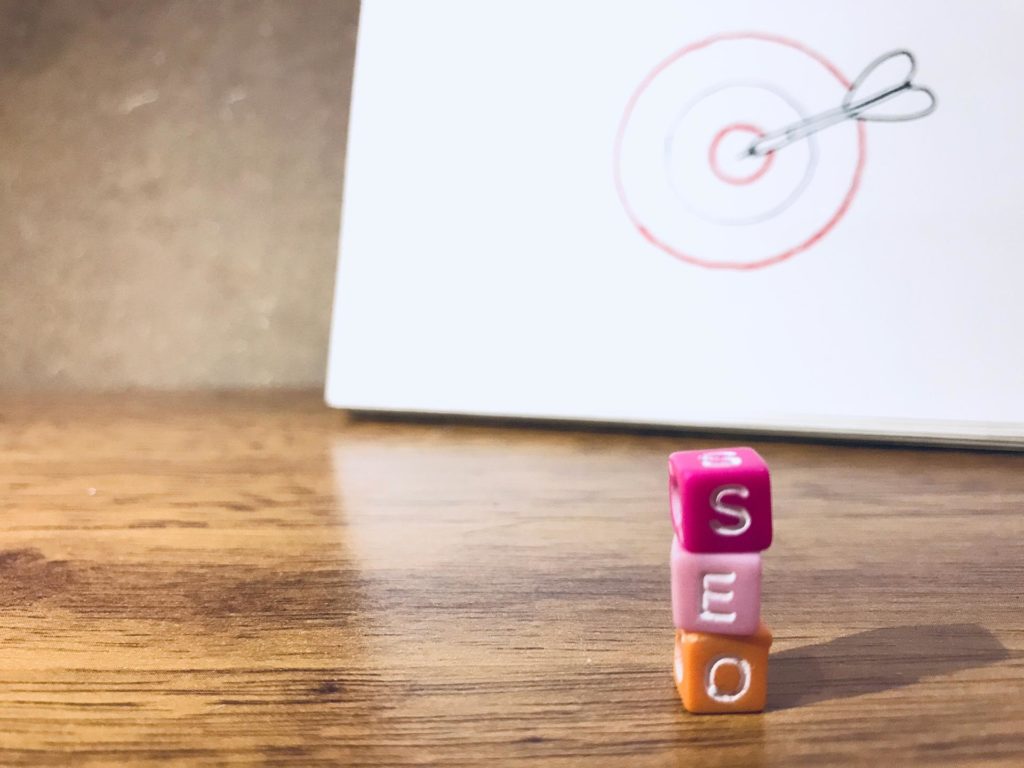 SEO with bullseye in background depicting the targeted approach a dental SEO marketing company can get with dental SEO services. 